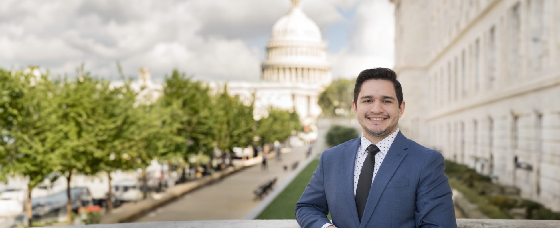 Man standing in front of government building