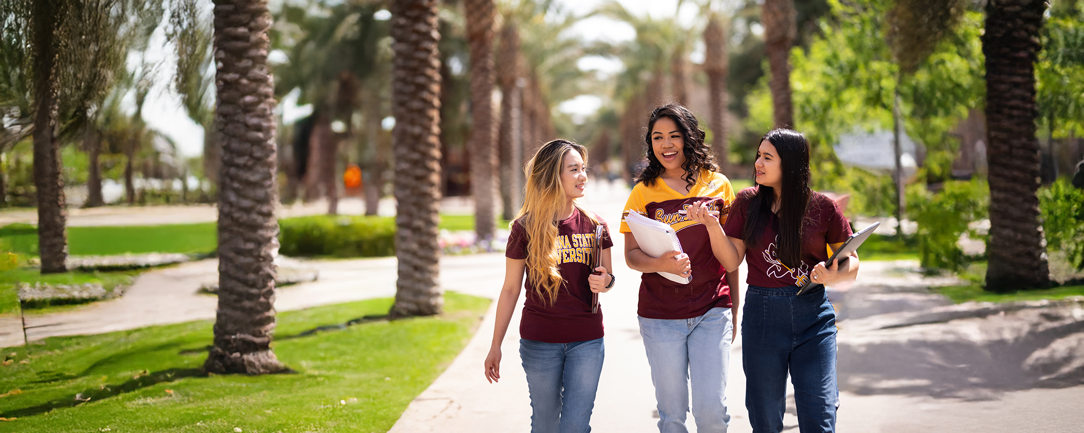 Three ASU students walking on campus