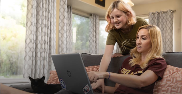 Mom and child looking at laptop