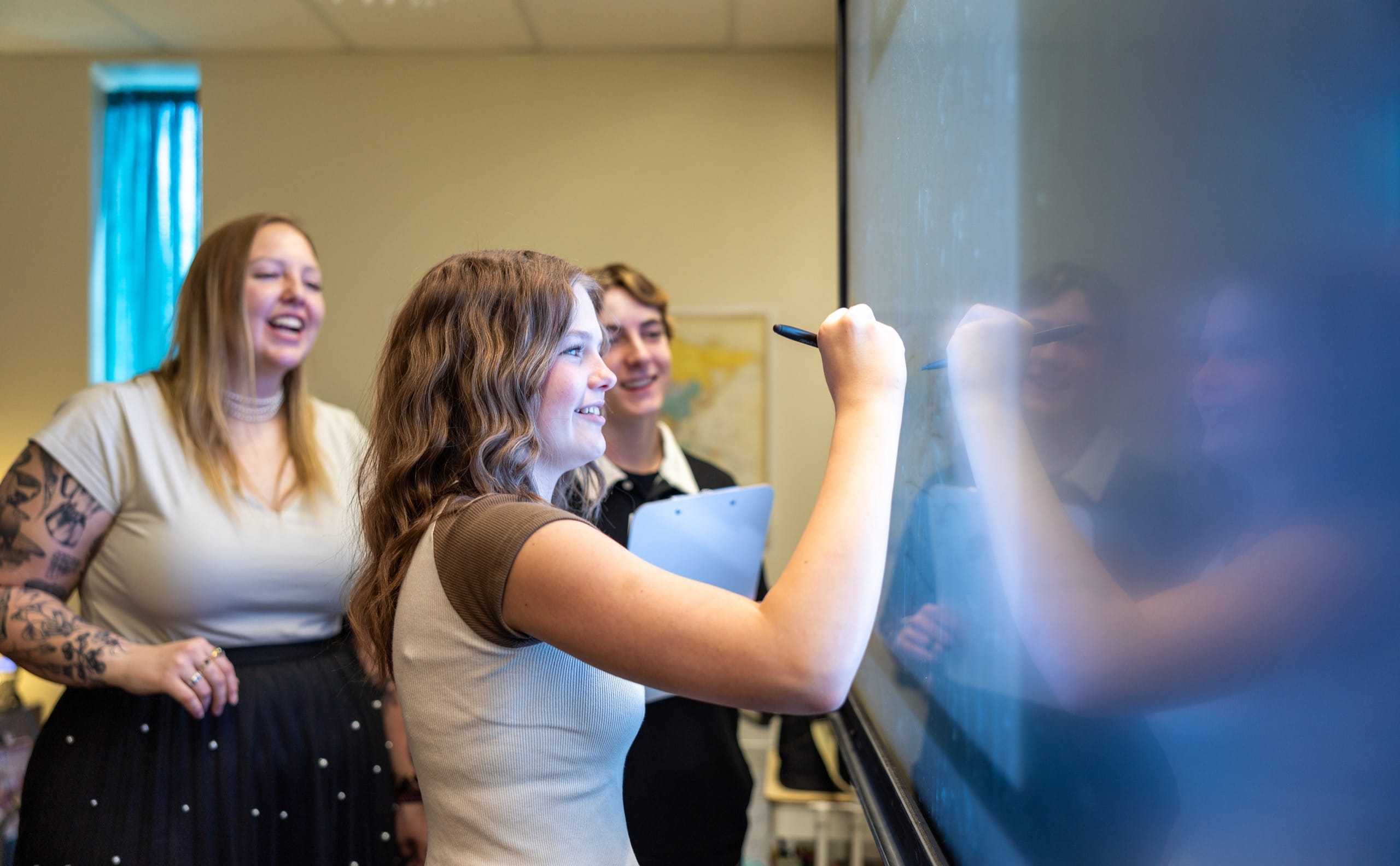 Students writing on a board