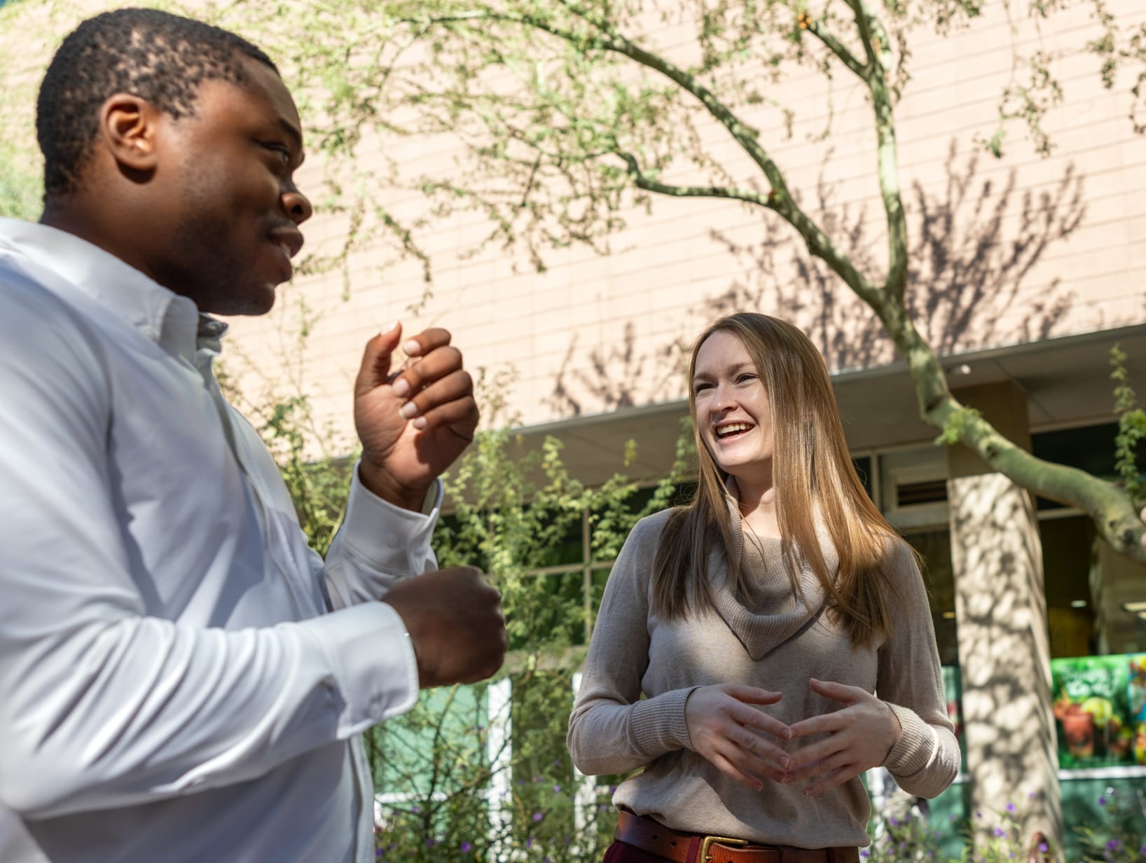 Two people outside talking