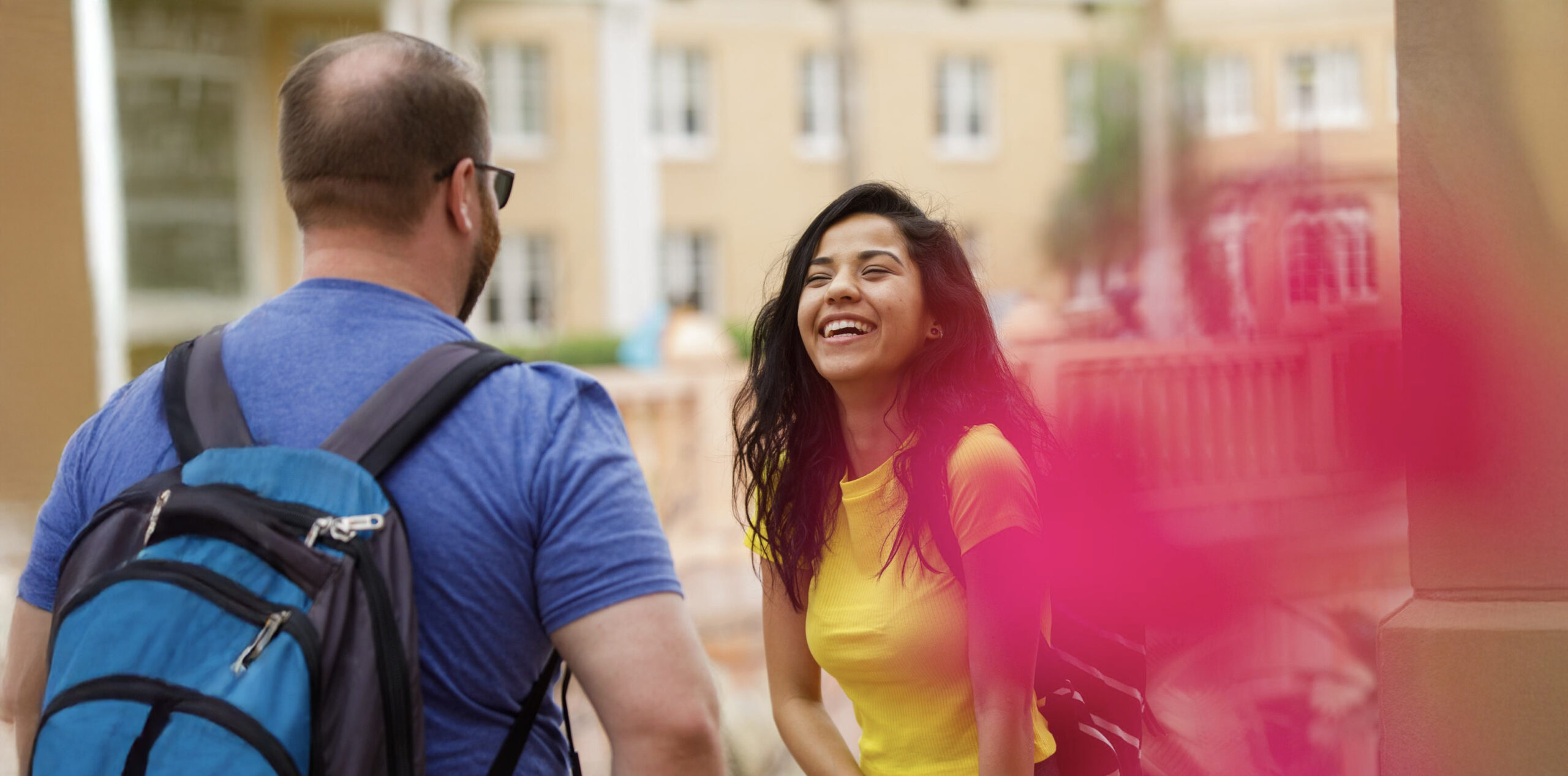 Man and woman talking on campus